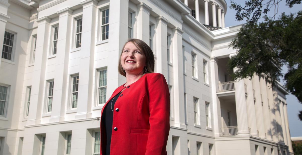 Barton Academy Principal Amanda Jones, a University of South Alabama graduate, stands in front of the new magnet school. 